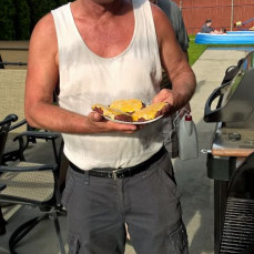 Timpa at the grill where he made the best burgers ever. - Grillmaster