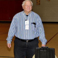 Jim doing Volunteer Examiner (VE) duty at the Stanwood Hamfest, 5/10/14. - Rick Hawkinson