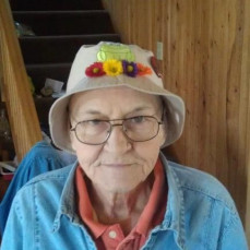 Mom wearing her favorite hat that her friend Marie made her. - Bradley Funeral Home