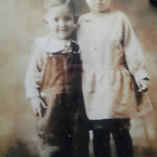 Aunt Mildred when she was a little girl. And I believe that's Grandpa she's with. - La Shaine Reynolds