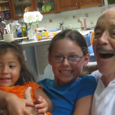 Dad enjoying his grandkids. - Ann Manatt