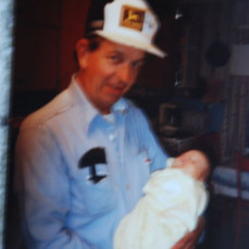 Pete holding James at 5 days old - James had just been fishing with Pete!   - Larry
