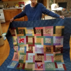 Picture of mom with cat and her last quilt - Debbie Weber