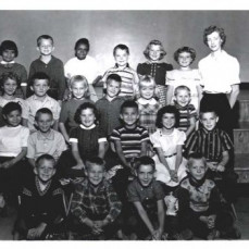 Photo of Ken's 2nd Grade Class at Bunderson Elementary. He is in the middle and third-row up. I am on the right with the vertical stripes - Robert Holmes