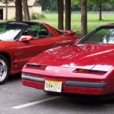 My brother and I at a car show... the red Formula was a gift from him, and he loved his burnt Orange Trans Am
this should be the pic and not the "Ford Mustang" that is under his picture   - CONSTANTINE GEORGATOS