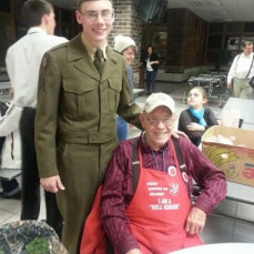 Grandpa Kelly and Padraic at Antigo High School. Padraic came home in leave and was doing a guest appearance in a play and Grandpa was ringing bells for the Salvation Army like usual.  - Heather Neta